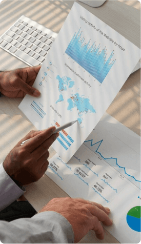 a discussion betwwn two hands on a chart and graph on paper