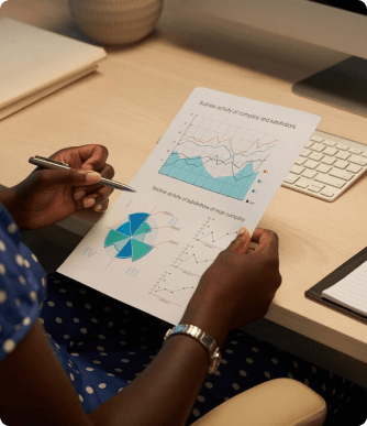 another hand checking out charts on a desk