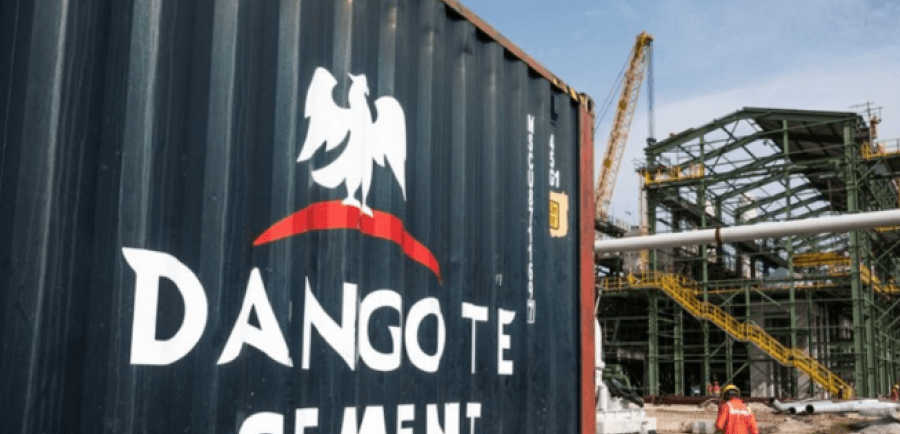 A shipping container with dangote cement printed on it