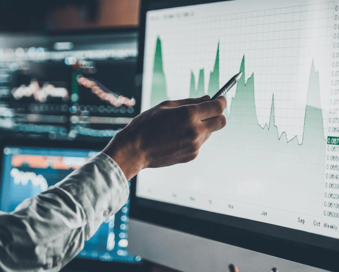 caucausian-hand-pointing-at-on-screen-chart